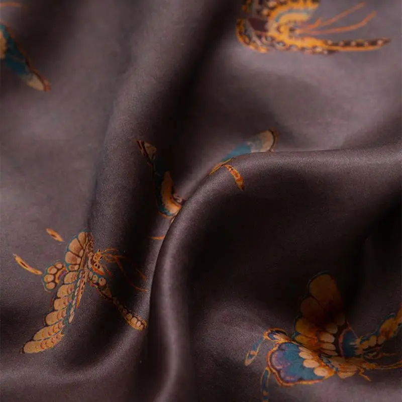 Air drying Xiangyunsha Silk on a padded hanger in the shade