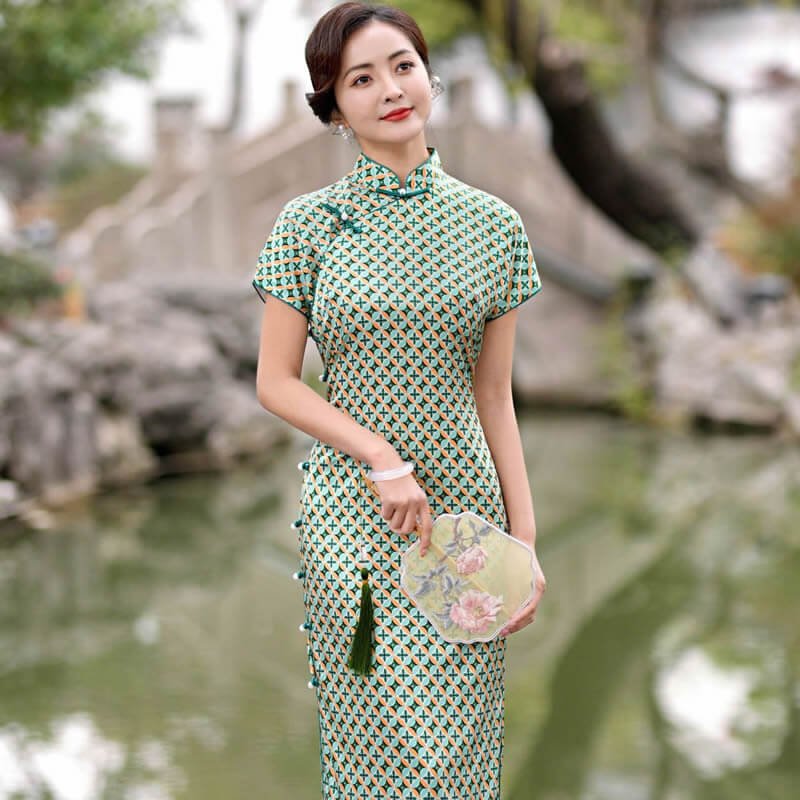 Elegant woman in daily life wearing Xiangyunsha Silk Cheongsam in modern setting.