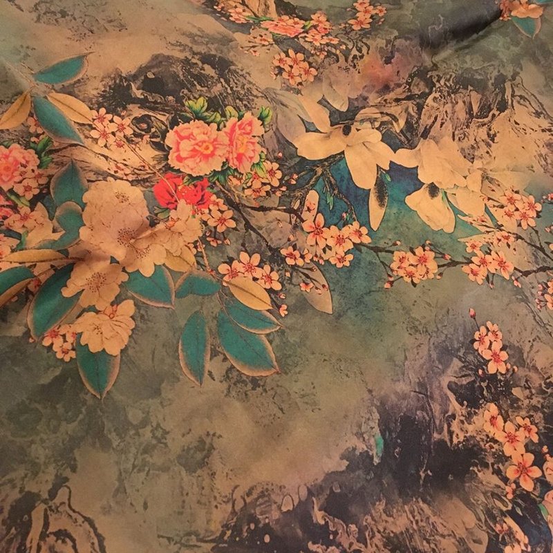 Artisans dyeing Xiangyunsha Silk using traditional plant-based dyes and mud.